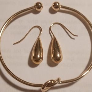Love knot bracelet & tear drop earrings  in gold tone.